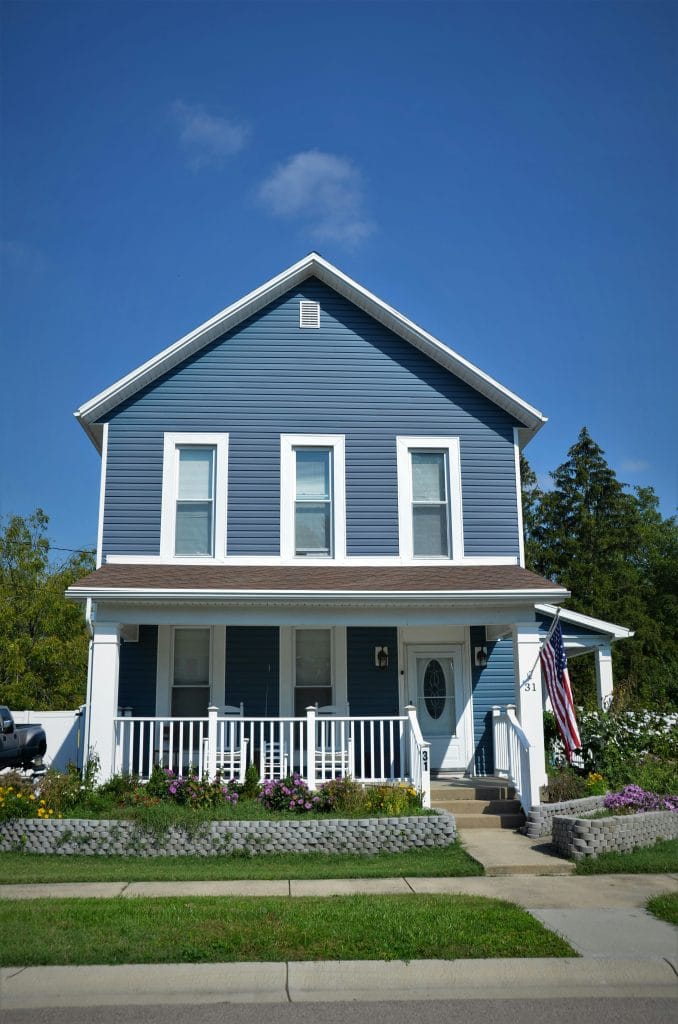 house with blue vinyl siding in casper